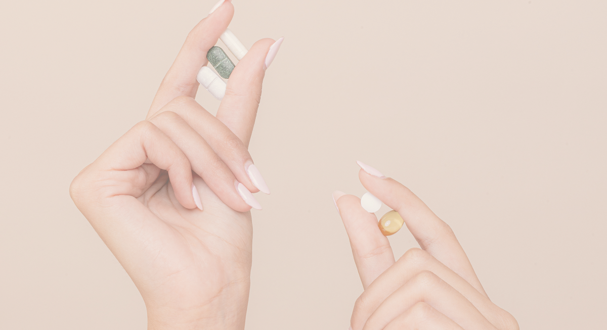 daily essentials capsules in hand