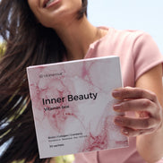 Woman holding a 'Inner Beauty Vitamin box' by vitameenat